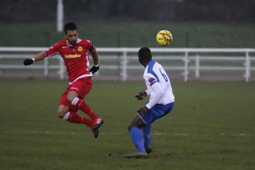 Mersthams Dan Bennett (L) and Enfields Percy Kiangebeni