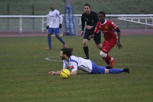 Mersthams Kershaney Samuels (red) brings down Harry Ottaway