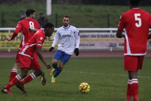 Mersthams Kristian Campbell clears as Scott Shulton tries to close down