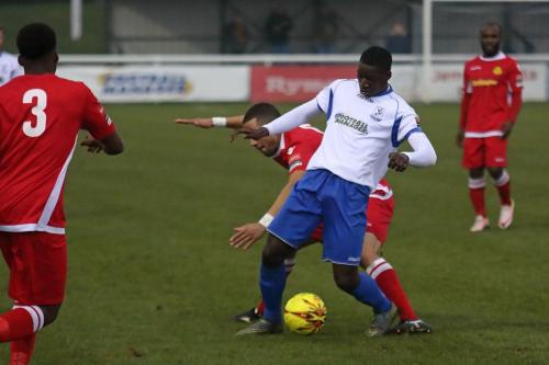 Percy Kiangebeni challenged by Tutu Henriques