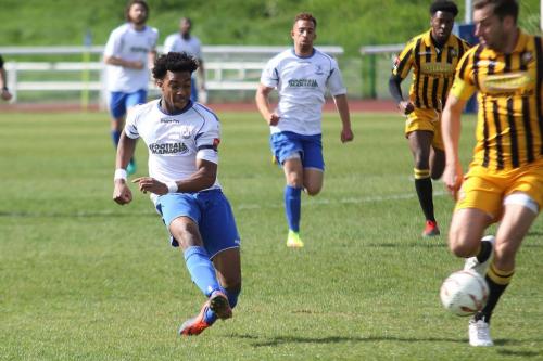 Enfields Dernell Wynter shoots from well outside the area but hits the post