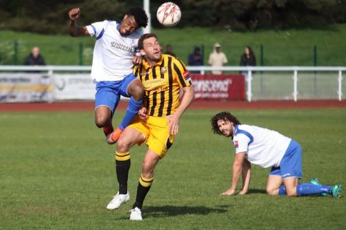 Enfields Harry Ottaway (R) watches as Dernell Wynter wins the ball against Liam Friend