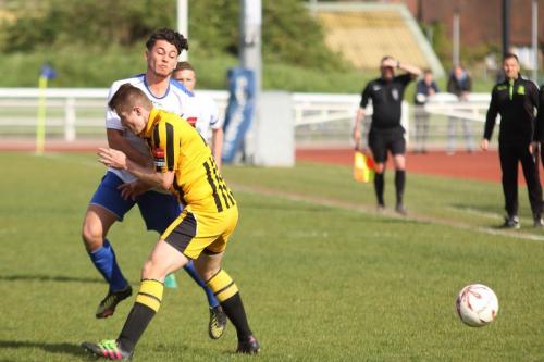 Enfields Samir Bihmoutine appears to be body checked by Callum Davies (R) but the referee saw nothing amiss