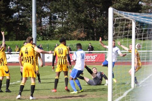Enfields Scott Shulton (white, R) heads narrowly wide