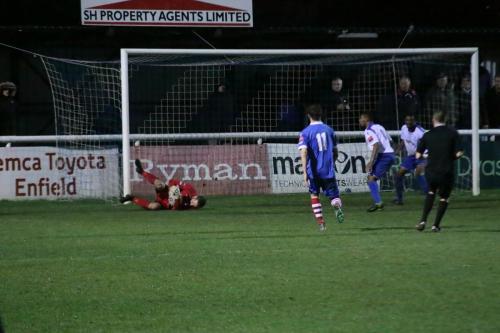 Enfield keeper NathanMcDonald cuts out a cross at his near post