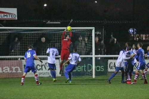 Enfield keeper Nathan McDonald catches a late cross