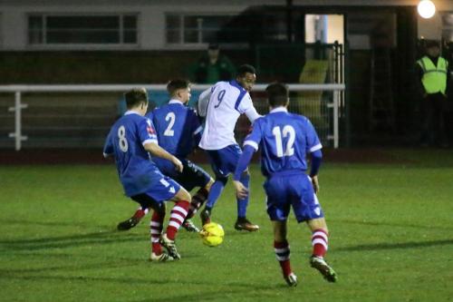 Enfields Bobby Devyne closely marked by Callum Harrison (8), Jake Dye (2) and Kem Izzet