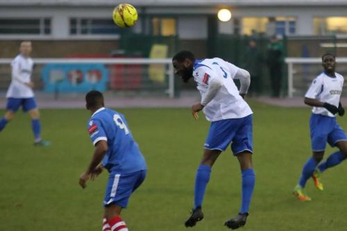 Enfields Harold Joseph heads clear from Reece Dobson