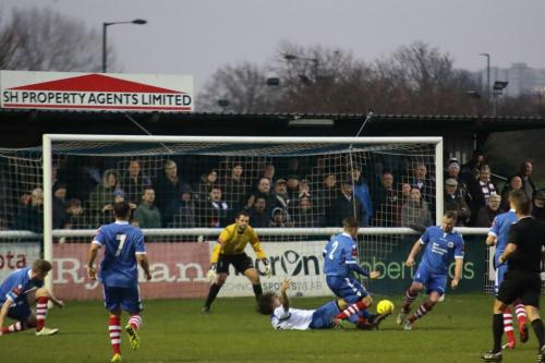 Enfields Harry Ottaway (white) appeals unsuccessfully for a penalty against Jake Dye (2)  It didnt matter as the ball was cleared for a corner and he scored from it