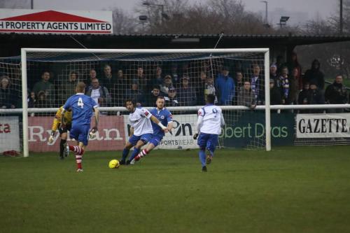 Enfields Harry Ottaway (white, L) holds off Sam Nunn