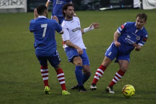 Enfields Harry Ottaway plays the ball between Luke Ingram (L) and Callum Harrison