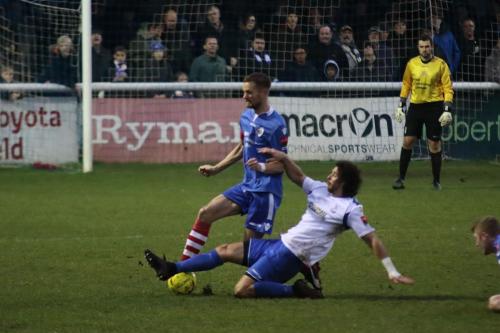 Enfields Harry Ottaway tackles Ian Miller