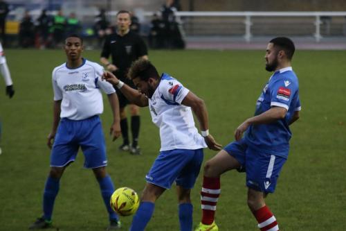 Enfields Jonathan Muleba (L) and Tyler Campbell and Needhams Luke Ingram