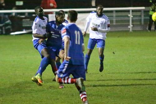 Enfields Percy Kiangebeni (L) clears from Reece Dobson