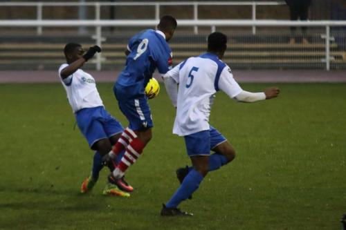 Enfields Percy Kiangebeni (L) tackles Reece Dobson