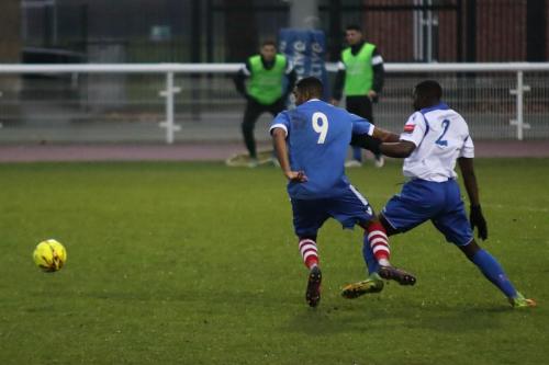 Enfields Percy Kiangebeni (R) tackles Reece Dobson