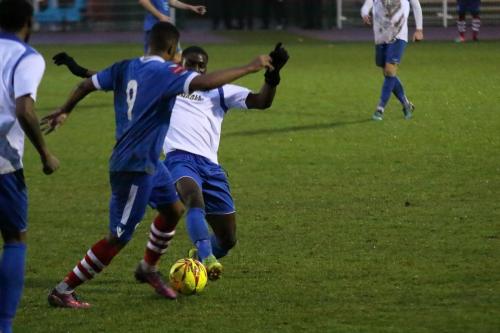 Enfields Percy Kiangebeni tackles Reece Dobson