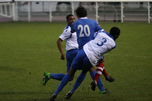 Enfields Ricky Gabriel (3) challenges Jack Curtis