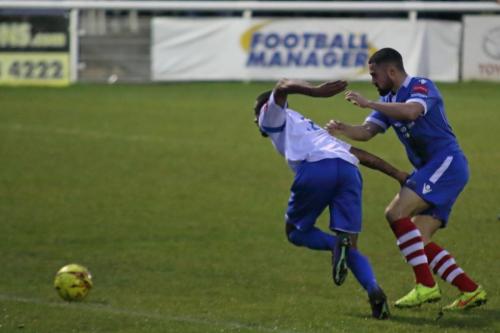 Enfields Ricky Gabriel (L) breaks away from Luke Ingram