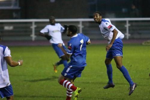 Enfields Ricky Gabriel (R) heads clear from Reece Dobson