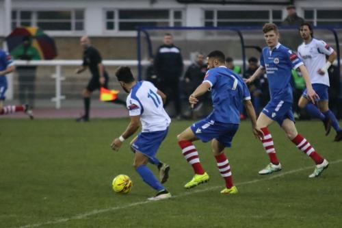 Enfields Tyler Campbell (L) breaks clear of Luke Ingram (7) and Billy Holland