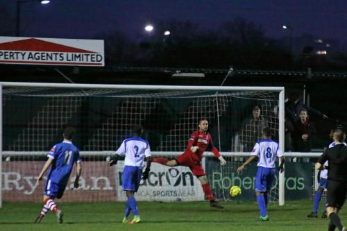 Enfields keeper Nathan McDonald miscues a punch