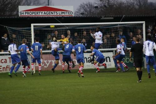 Harry Ottaway just beats Needham keeper Danny Gay to make the score 2-2