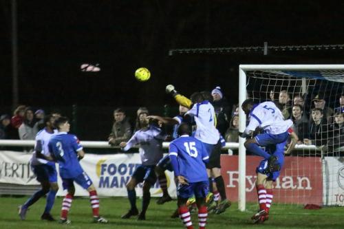 Needham keeper Danny Gay punches clear