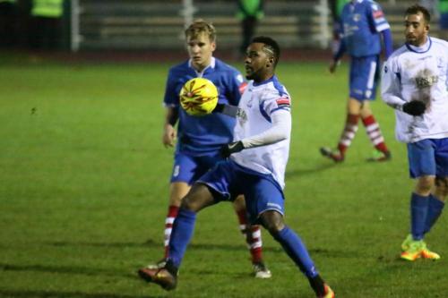 Needhams Callum Harrison (blue) and Enfields Bobby Devyne