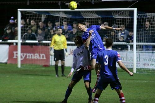 Needhams Ian Miller wins a header against Harry Ottaway