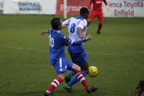 Needhams Jack Curtis (L) challenges Jonathan Muleba