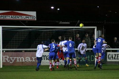 Needhams John Sands (16) challenges at a corner