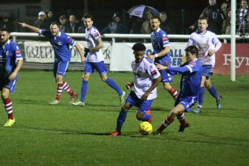 Needhams Kem Izzet (R) challenges Dernell Wynter