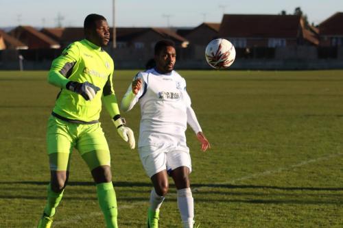Grays Amadou Tangara (L) and Enfields Bobby Devyne