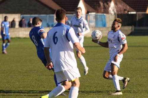 Grays Harry Watkins (8) clears from Tyler Campbell