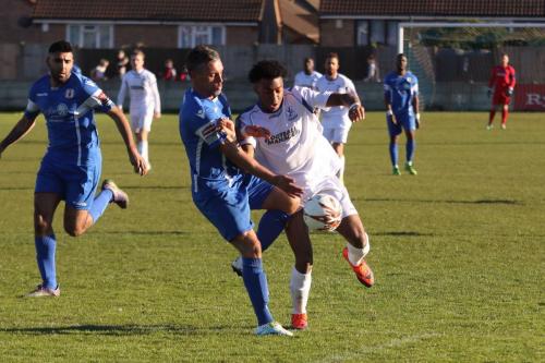 Grays Jamie Stuart (blue) challenges Dernell Wynter