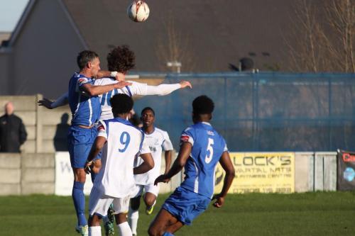 Grays Jamie Stuart (blue, L) challenges Harry Ottaway