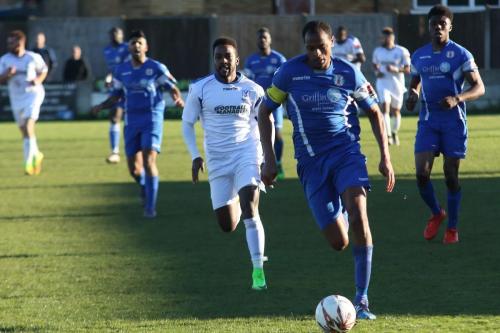 Grays Nathan Campbell (blue) and Enfields Bobby Devyne