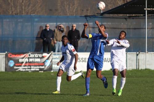 Grays Nathan Campbell and Enfields Trey Williams (L) and Bobby Devyne