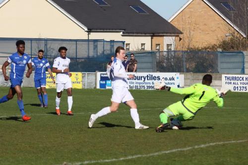 Grays keeper Amadou Tangara half-saves from Mickey Parcell whose follow up effort was turned into the net by Scott Shulton for the second Enfield goal