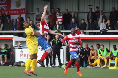 Enfields Dernell Wynter and Harlows Craig Pope and Ibrahima Sonko (R)