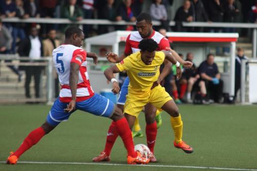 Enfields Dernell Wynter challenged by Ibrahima Sonko (5) and Stanley Muguo