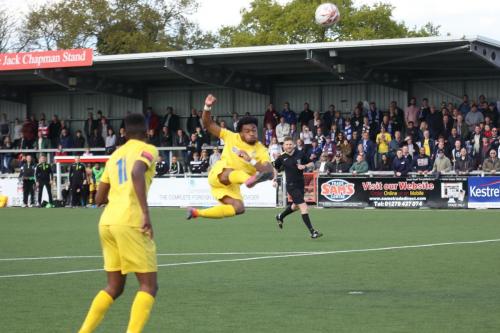 Enfields Dernell Wynter tries an acrobatic shot but cant keep the ball down