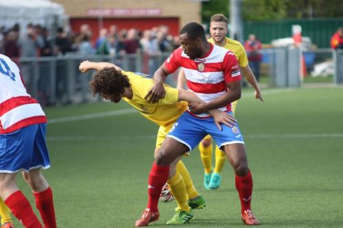 Enfields Harry Ottaway (yellow) and Harlows Stanley Muguo