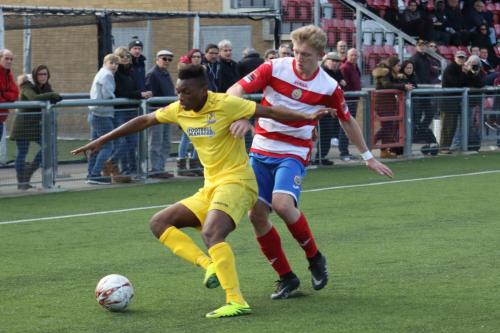 Enfields Karl Oliyide (L) and Harlows Charlie Dickens