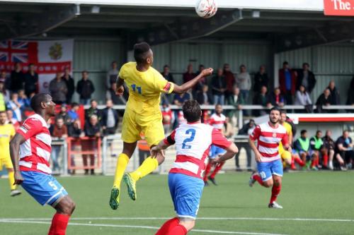 Enfields Karl Oliyide wins a header