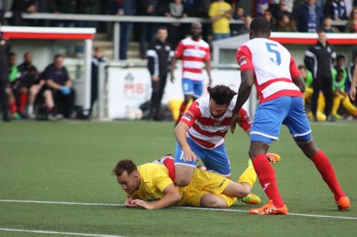 Enfields Scott Shulton (yellow) and Harlows Ibrahima Sonko (5) and Mario Noto