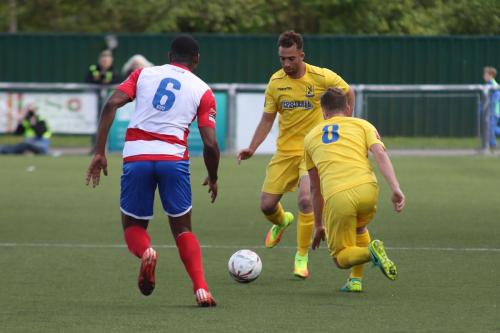 Enfields Scott Shulton and Billy Crook (8) and Harlows Stanley Muguo
