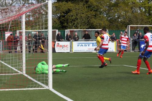 Harlow keeper David Hughes saves from Dernell Wynter (yellow)