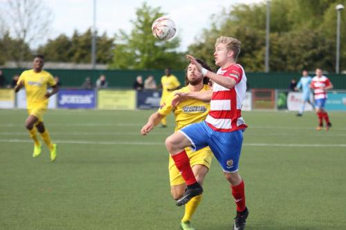 Harlows Charlie Dickens (R) clears from Harry Ottaway